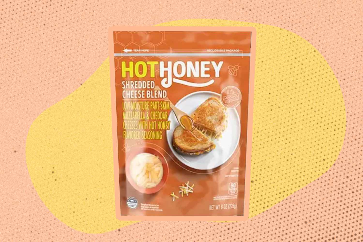 Hot Honey Shredded Cheese Blend bag over a colorful background