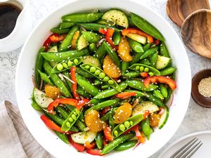 Spring snap pea salad in large serving bowl.