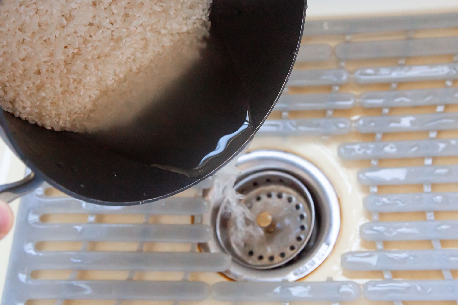 Drain Water from Washed Rice for Sushi Rice Recipe 