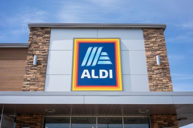 Outside view of an ALDI store with a large ALDI sign