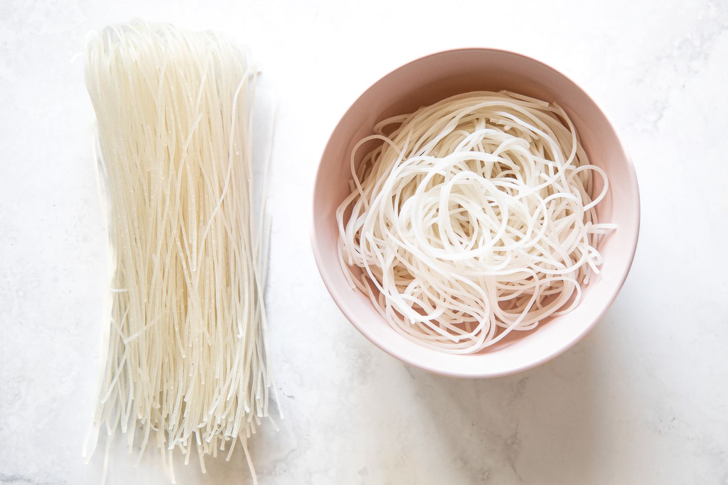 Dried Rice Vermicelli Noodles on the Left and Cooked Rice Vermicelli Noodles in a Bowl on the Right