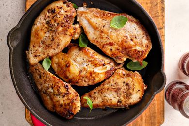 cooked seasoned chicken breast in a cast iron skillet