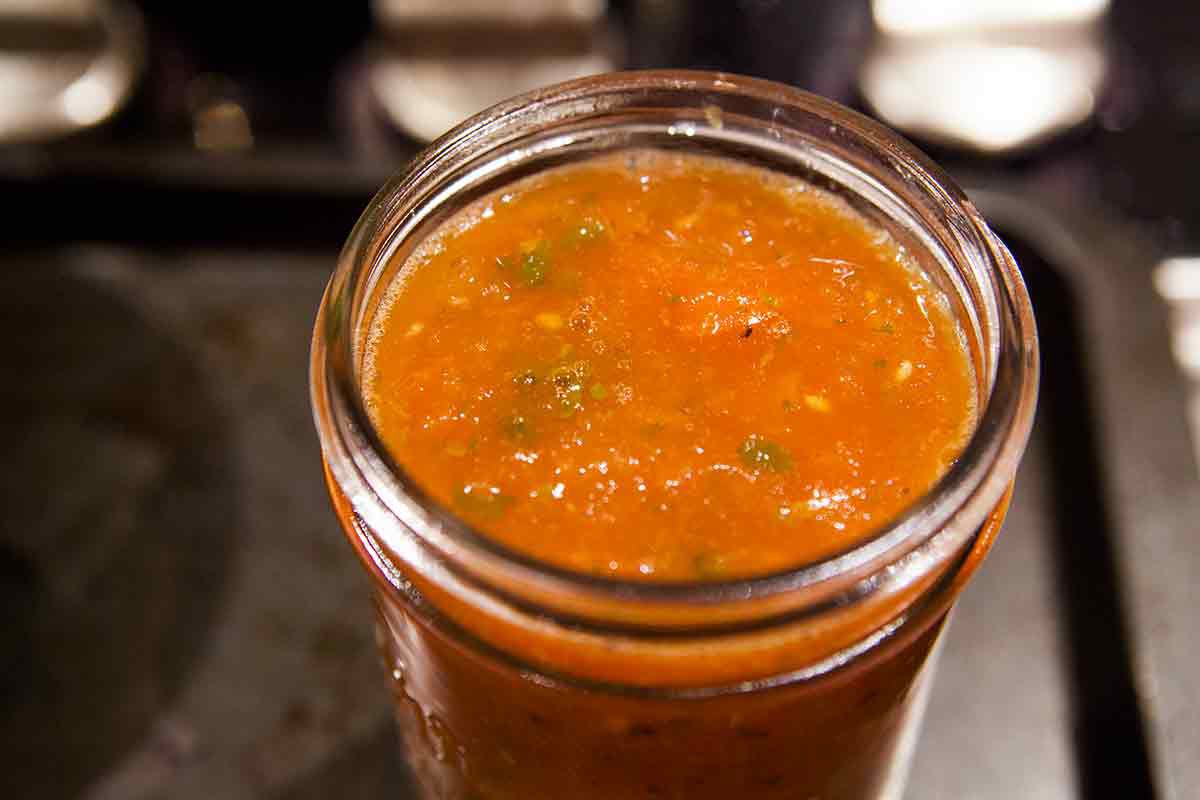 how to can salsa - putting salsa into canning jars