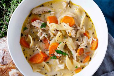 A bowl of creamy chicken noodle soup