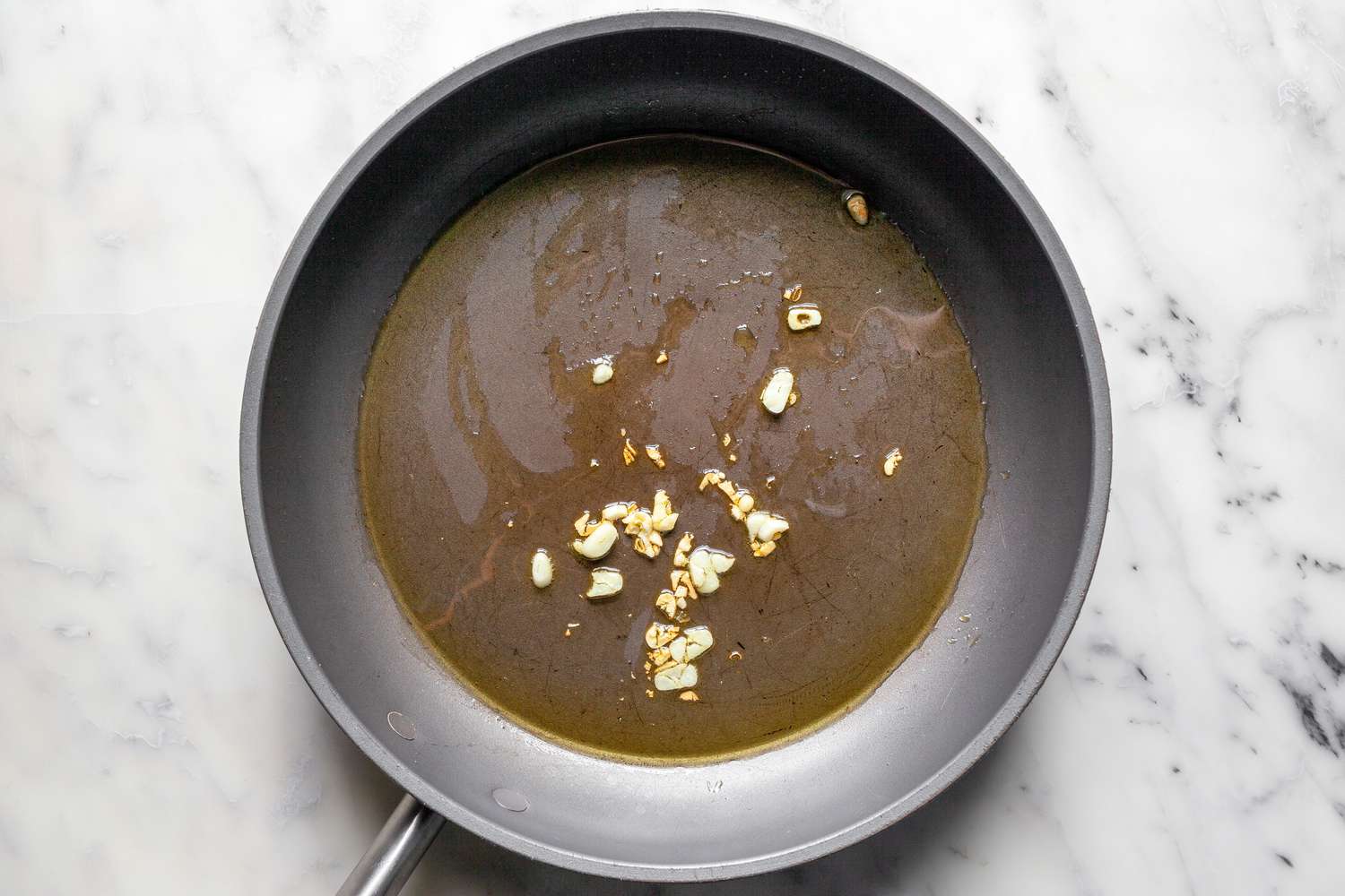 Olive Oil and Garlic in a Skillet for Stuffed Shells Recipe