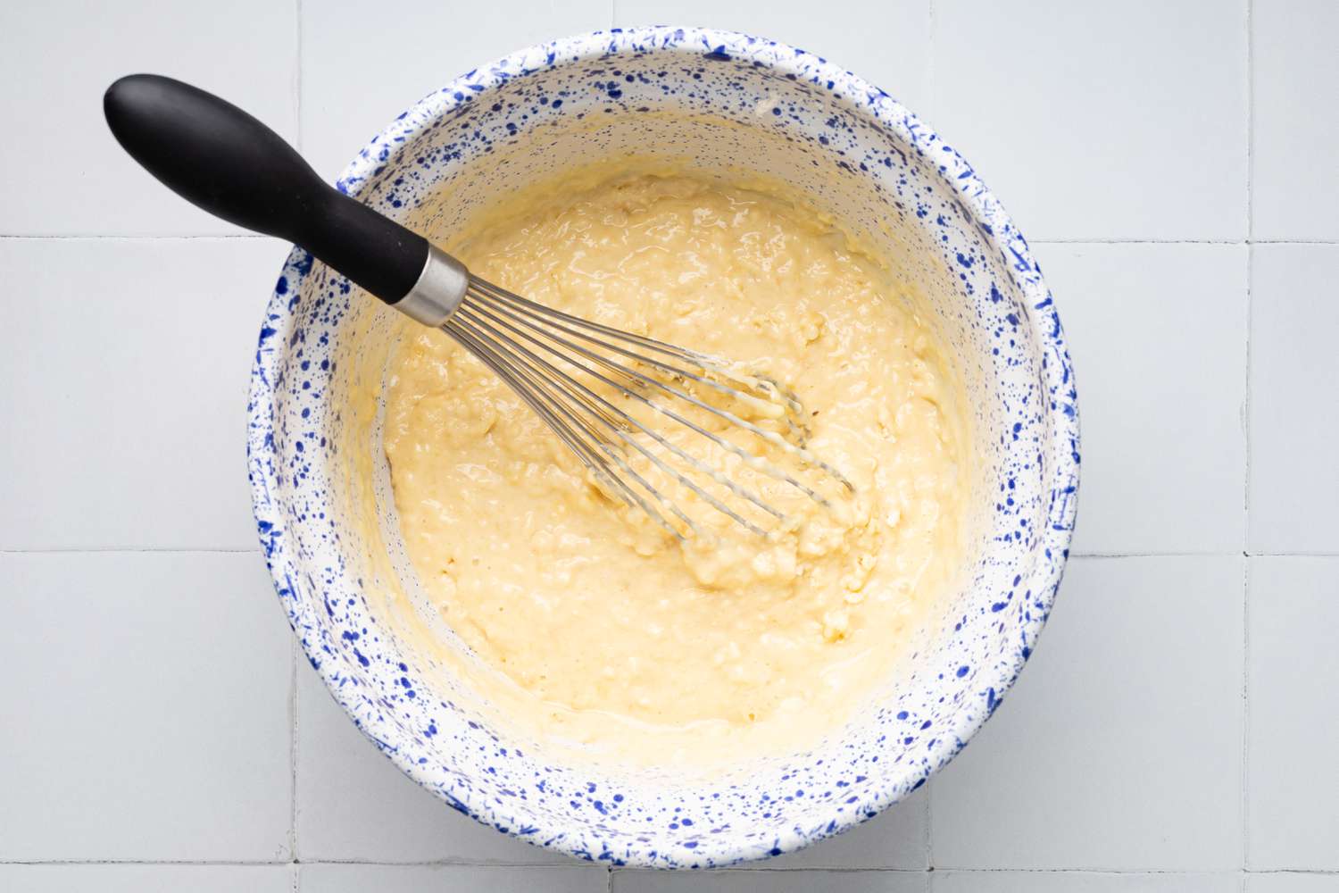 Wet Ingredients Mixed into Bowl of Dry Ingredients for Banana Chocolate Chip Muffins