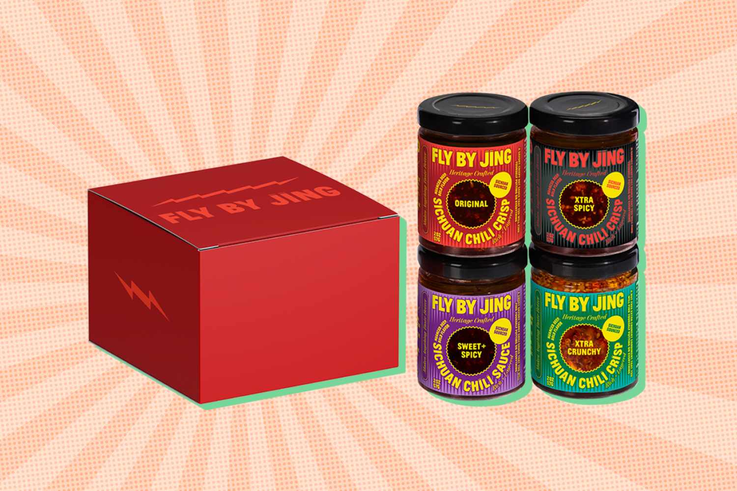 A gift box and four jars of Fly by Jing sauces arranged together