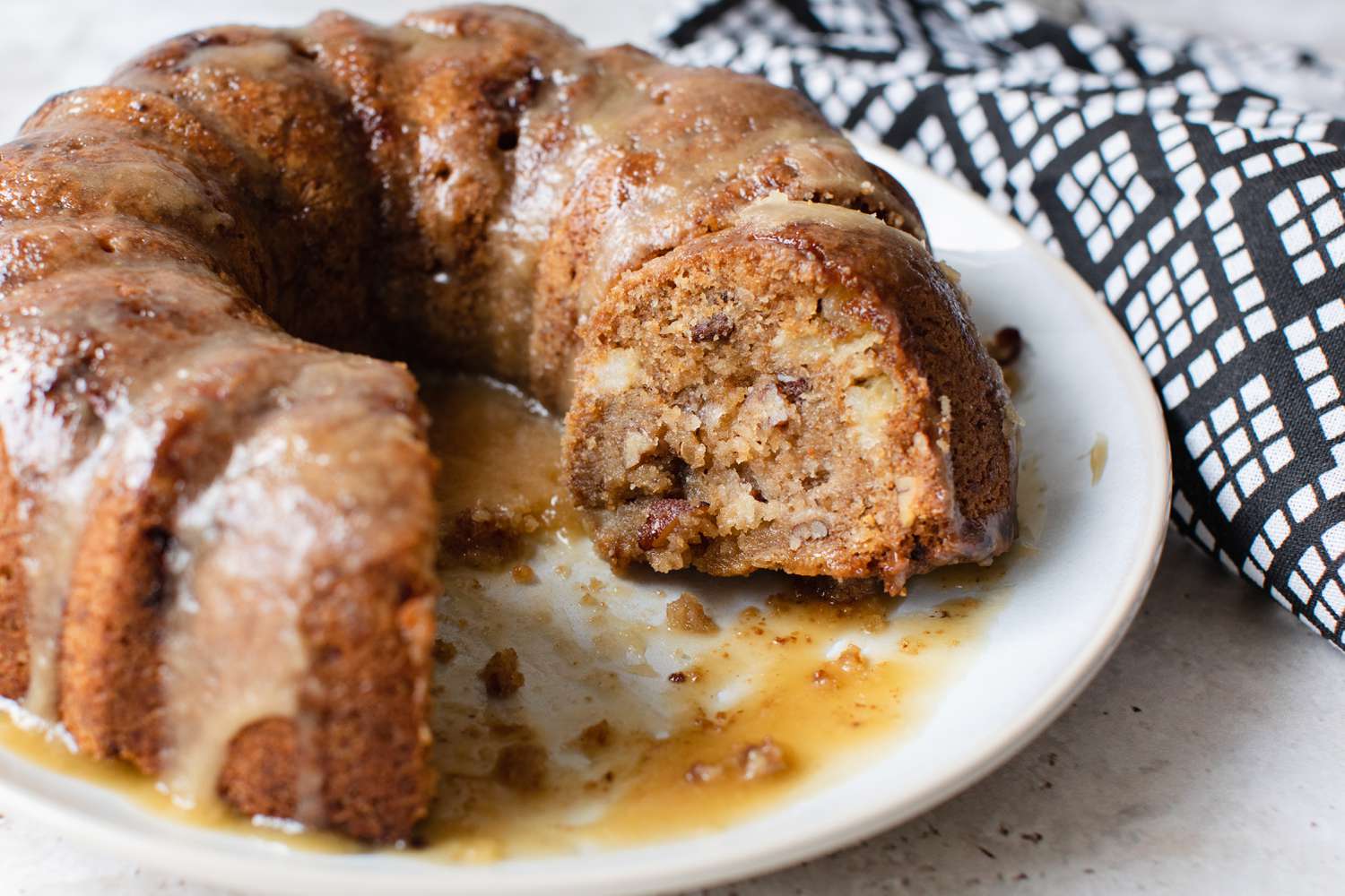 Apple Bundt Cake on a Plate with Piece Cut Out