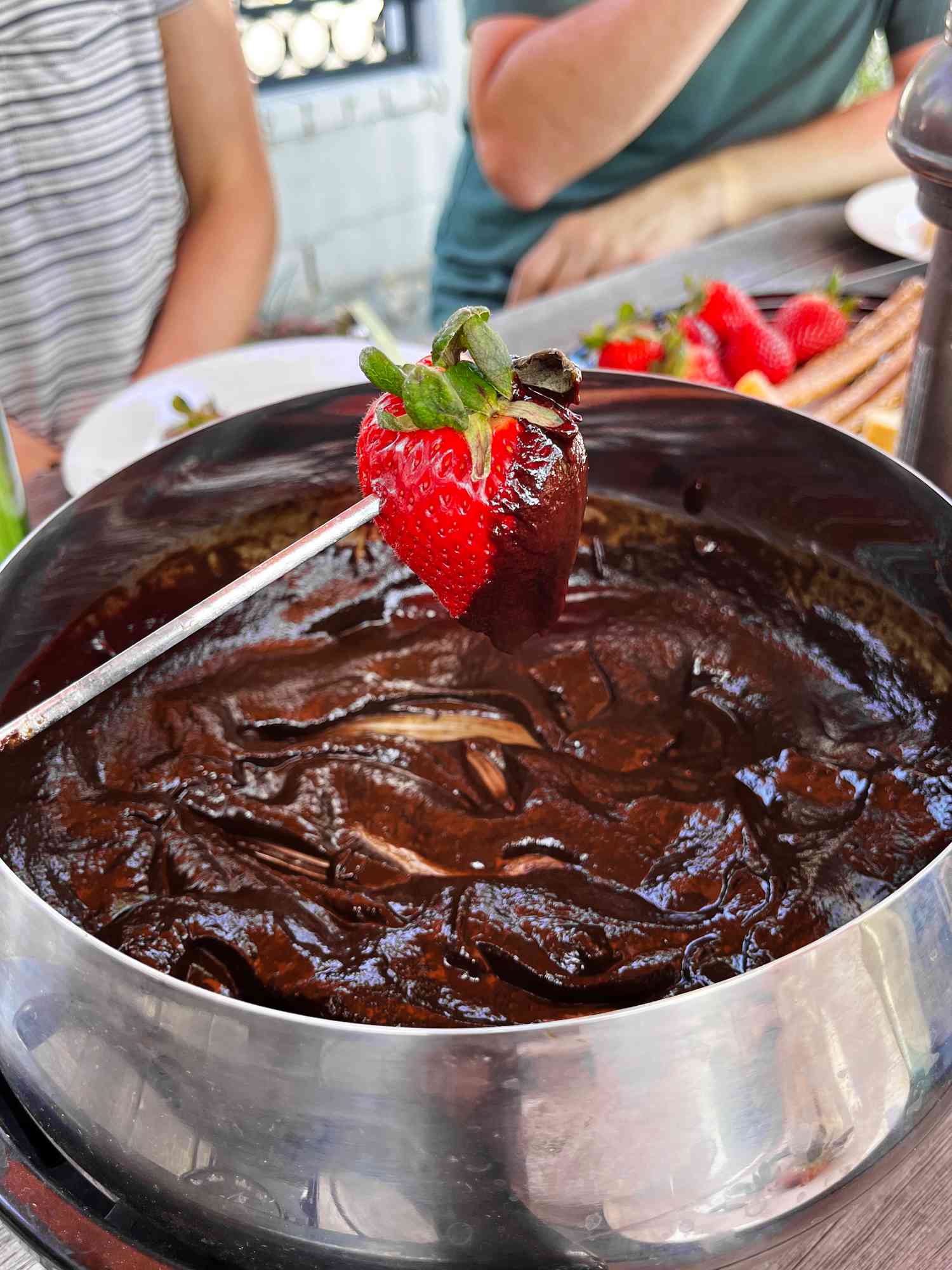 Strawberry dipped in chocolate fondue