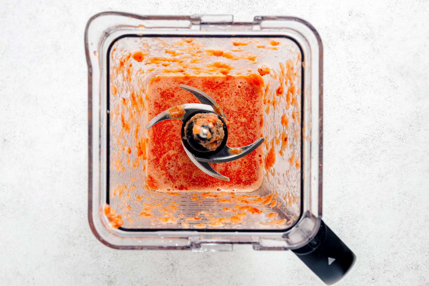 blender with tomato sauce in it (overhead shot)