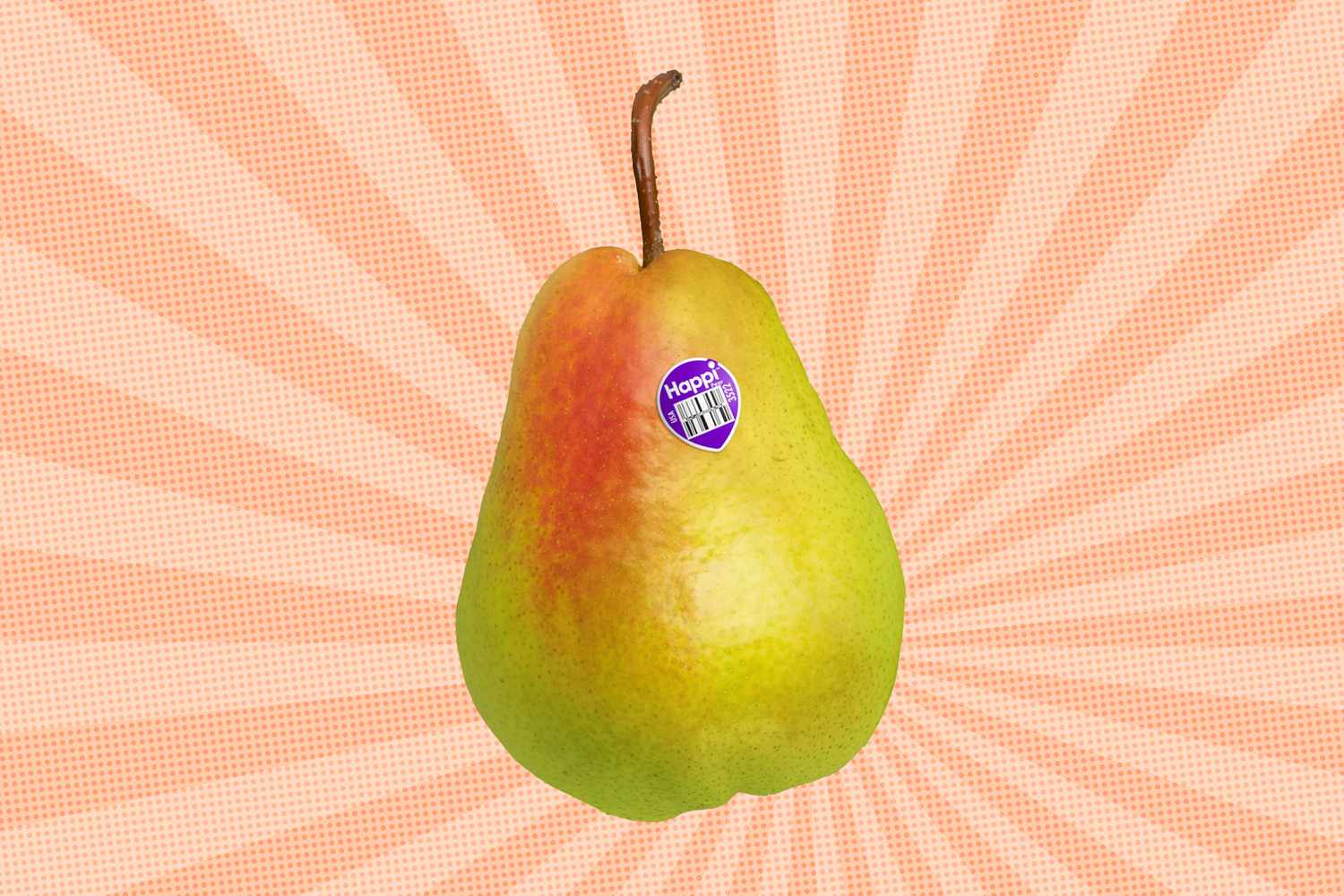 A pear with a sticker on it displayed on a radiating background