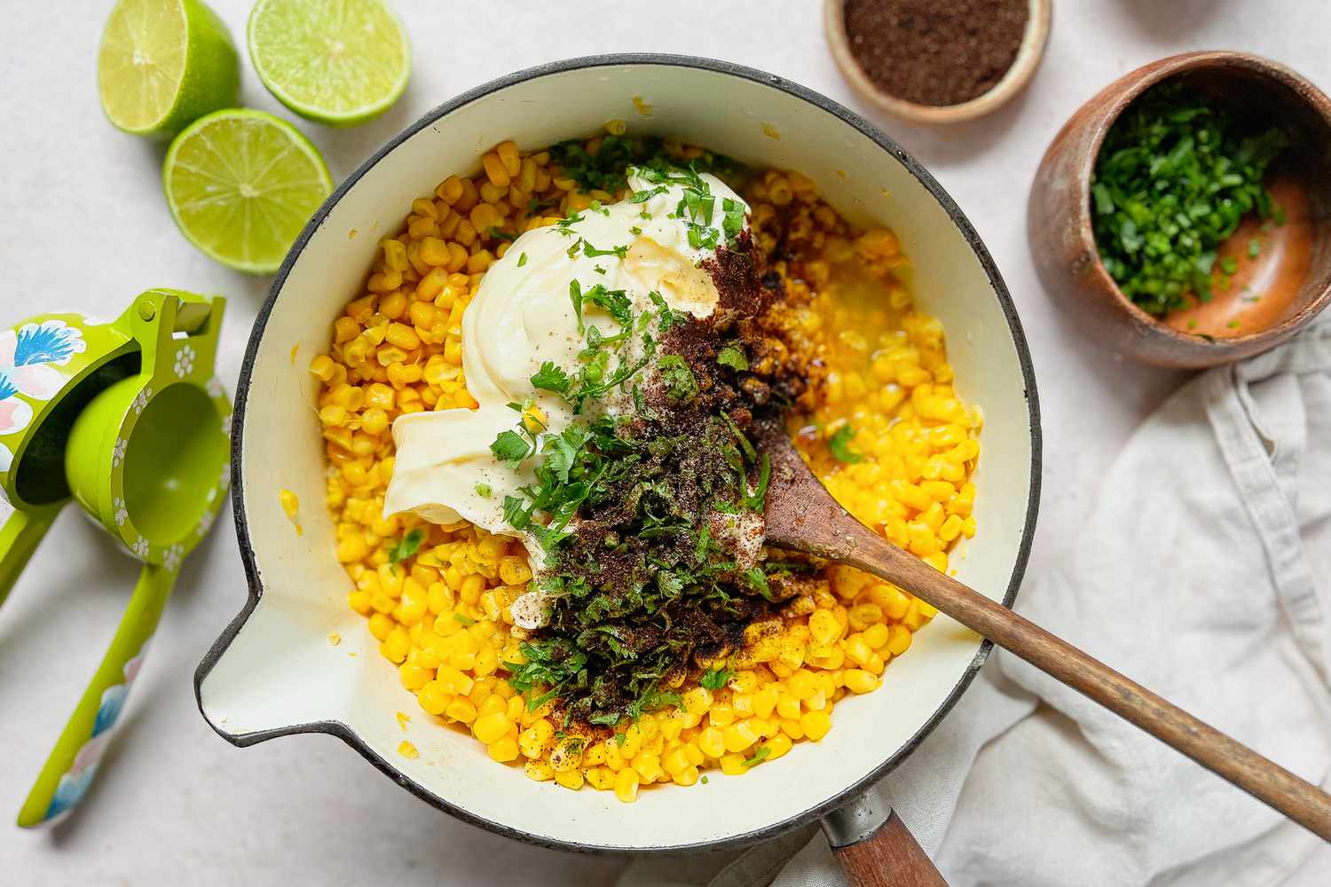 Mayo, Pepper, and Cilantro Added to Cooked Corn for Esquites