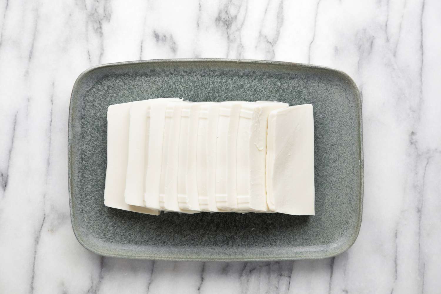 Silken Tofu Slabs Fanned onto the Platter for Sesame Soy Sauce Silken Tofu Recipe