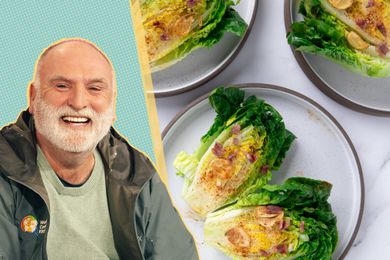 José Andrés alongside plates of little gem salad with garlic dressing
