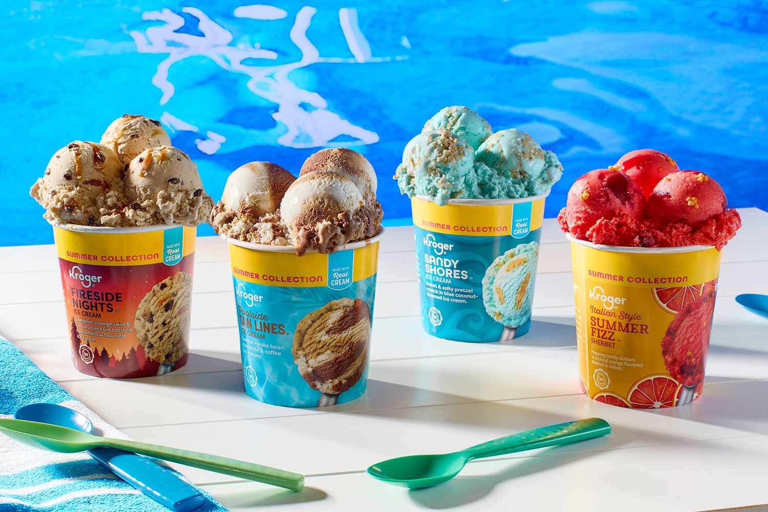 Four containers of Kroger branded ice cream varieties on a white surface with swimming pool in the background