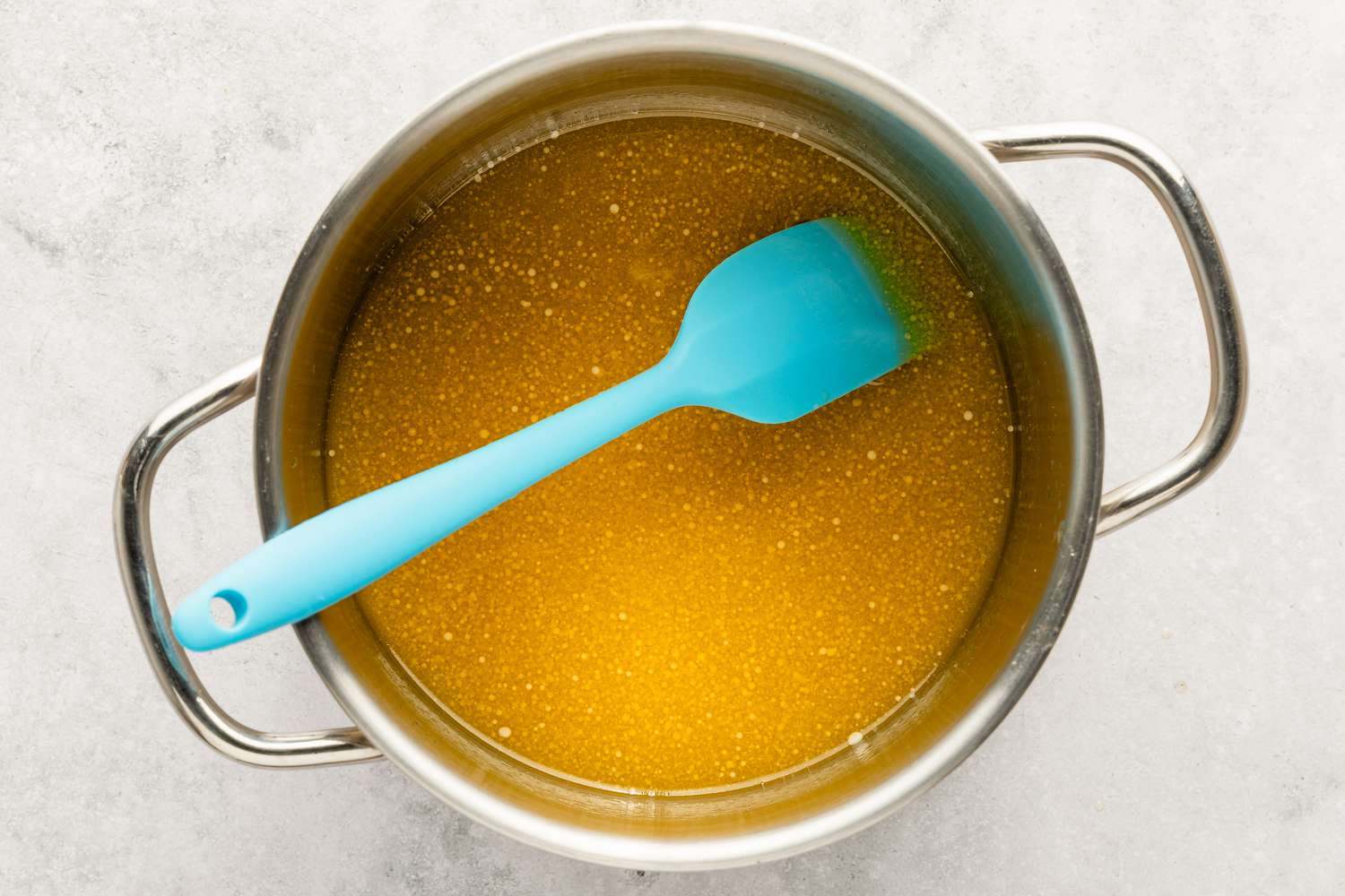 Honey and butter for the Anzac Biscuits recipe in a small sauce pan