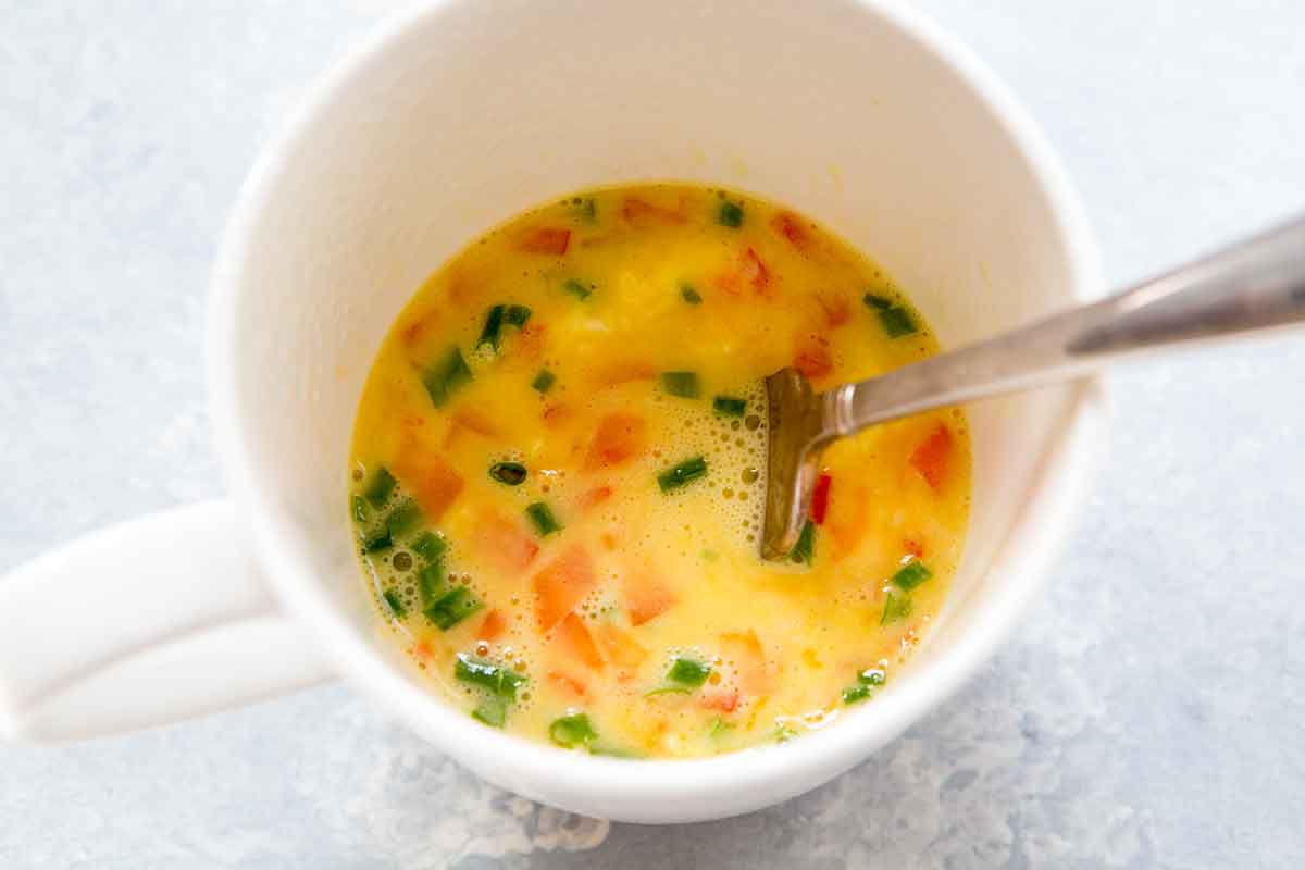 how to cook eggs in the microwave - stirring omelette ingredients