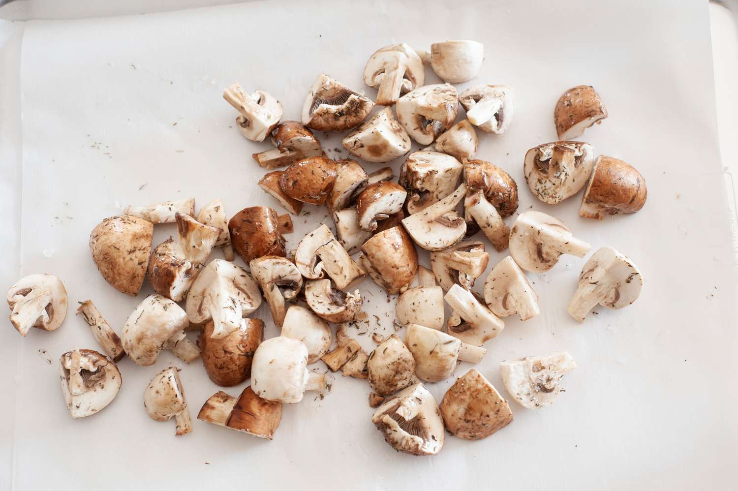 Mushrooms Quartered and Seasoned on a Sheet Pan 