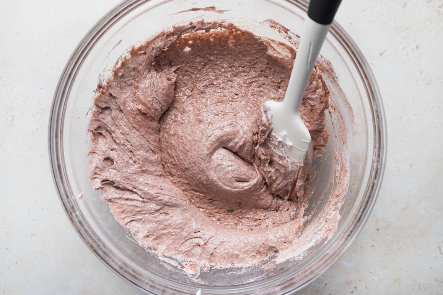 Stirring bowl to make chocolate macaron shells.