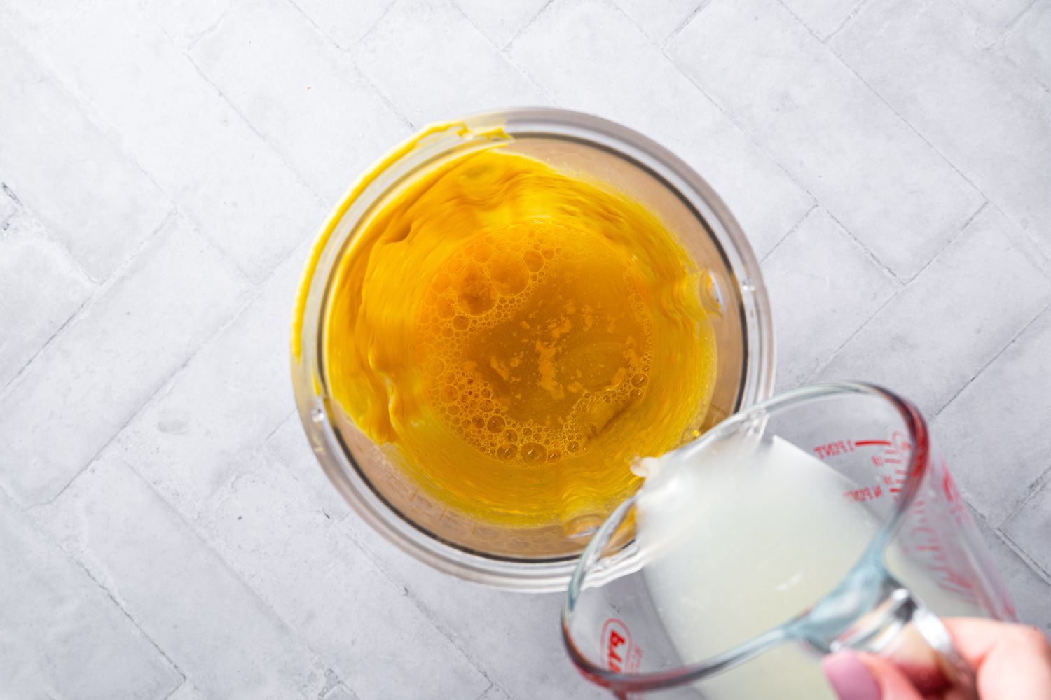 Reserved Pasta Water Poured into Blender 