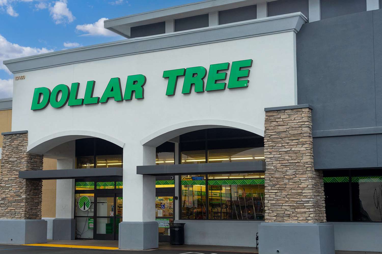 Exterior view of a Dollar Tree store with its logo displayed on the facade