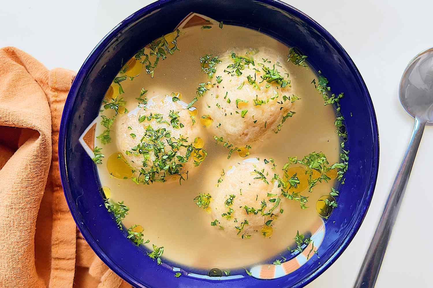 Matzo ball soup in a bowl