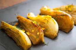 Braised Fennel on a Plate and Garnished with Lemon Zest and Fresh Dill 