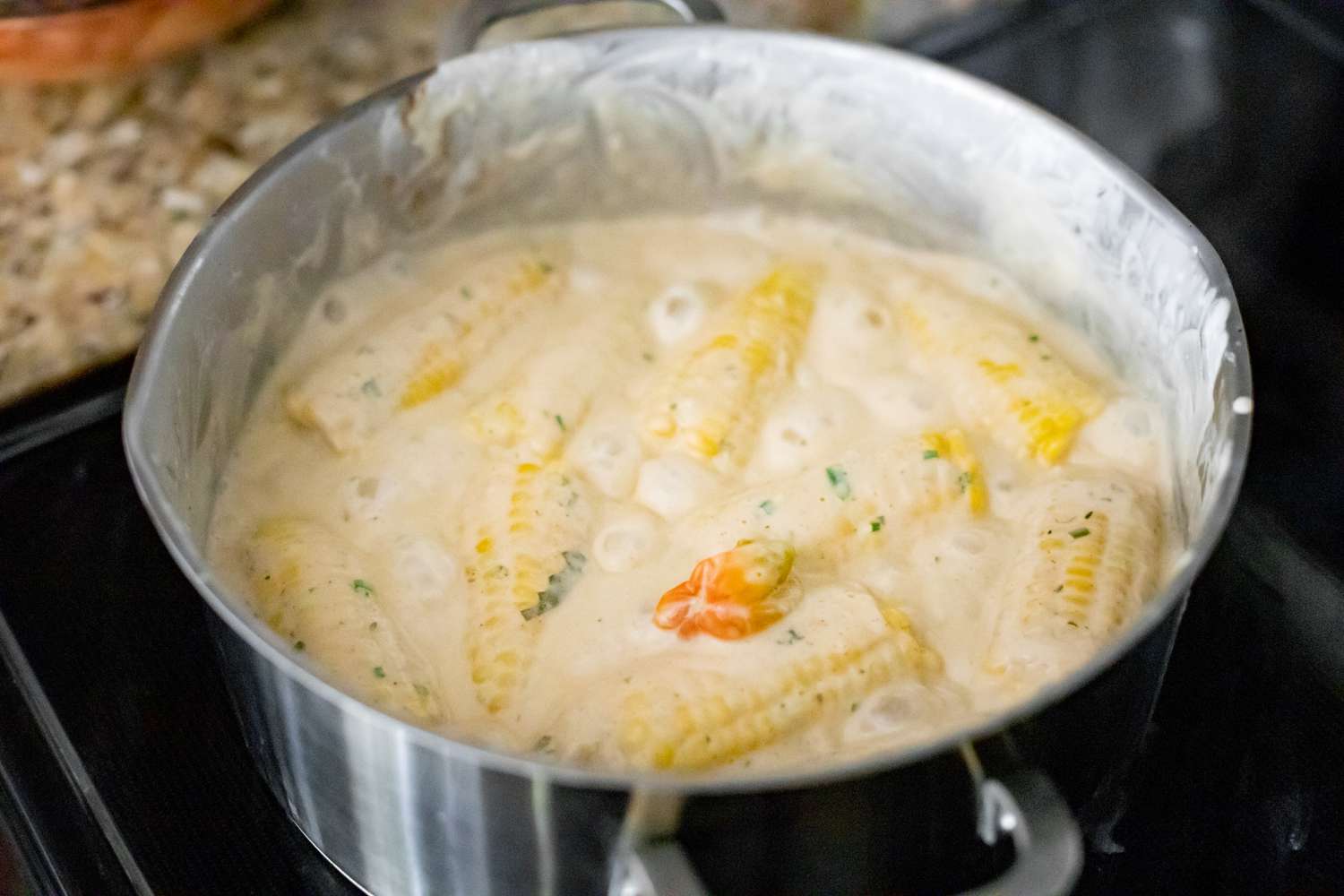 Pot of Trinidadian Boiled Corn Boiling on a Stove