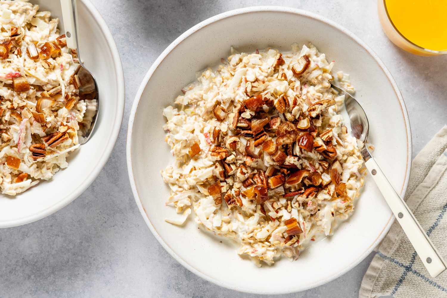 Overhead shot of a bowl of muesli with milk and a spoon