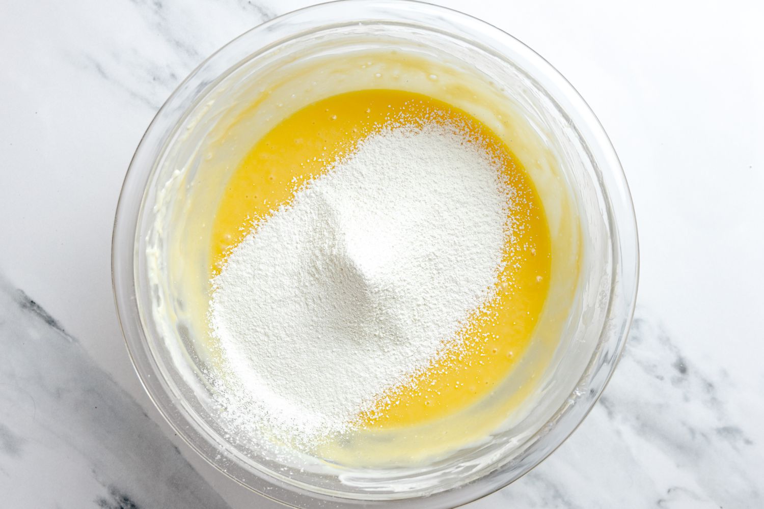 Pile of Sifted Dry Ingredients in the Bowl of Cream Cheese Mixture