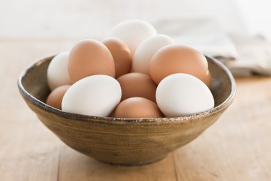 white and brown eggs in a bowl