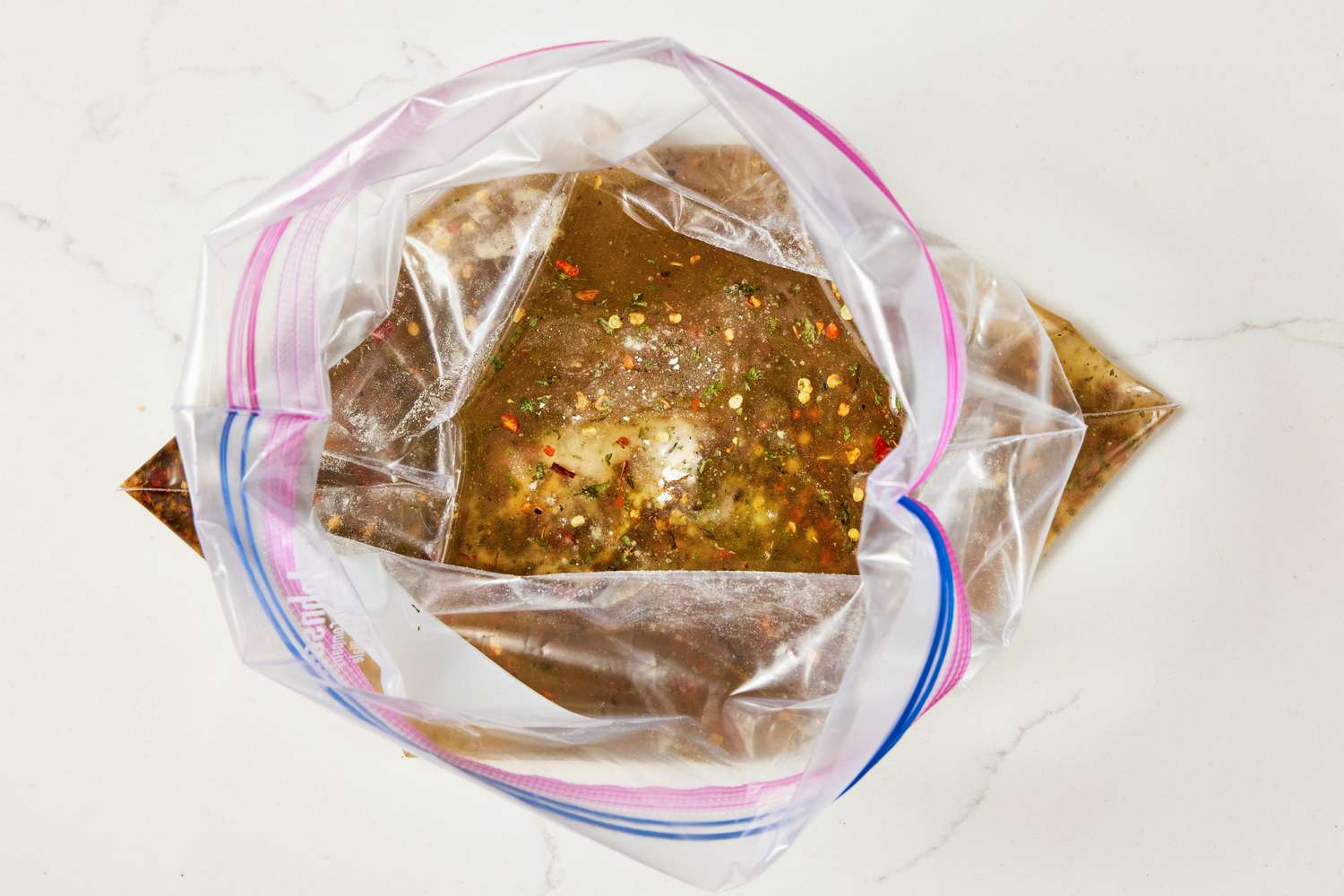 Seasoning and oil in a large ziploc bag for Alabama fire crackers recipe