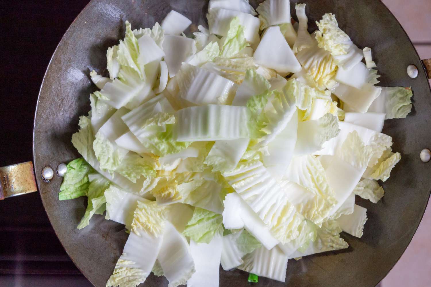 Cabbage added to a wok to make Napa Cabbage with Dried Shrimp