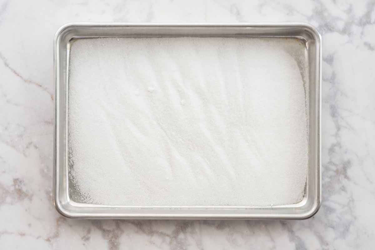 Authentic Tres Leches Cake Recipe coat pan with sugar