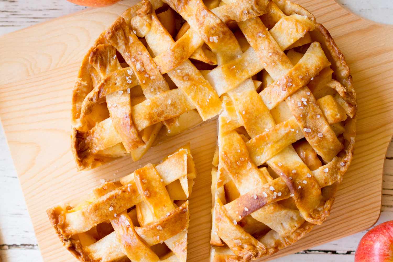 An apple pie on a wooden board