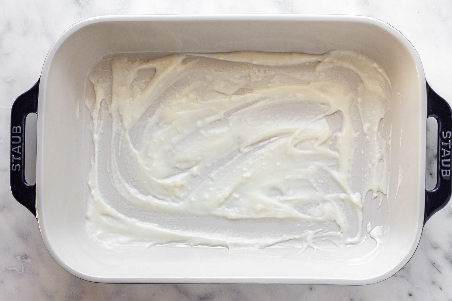 Chicken Lasagna Layering: Sauce Smeared on the Bottom of the Casserole Dish