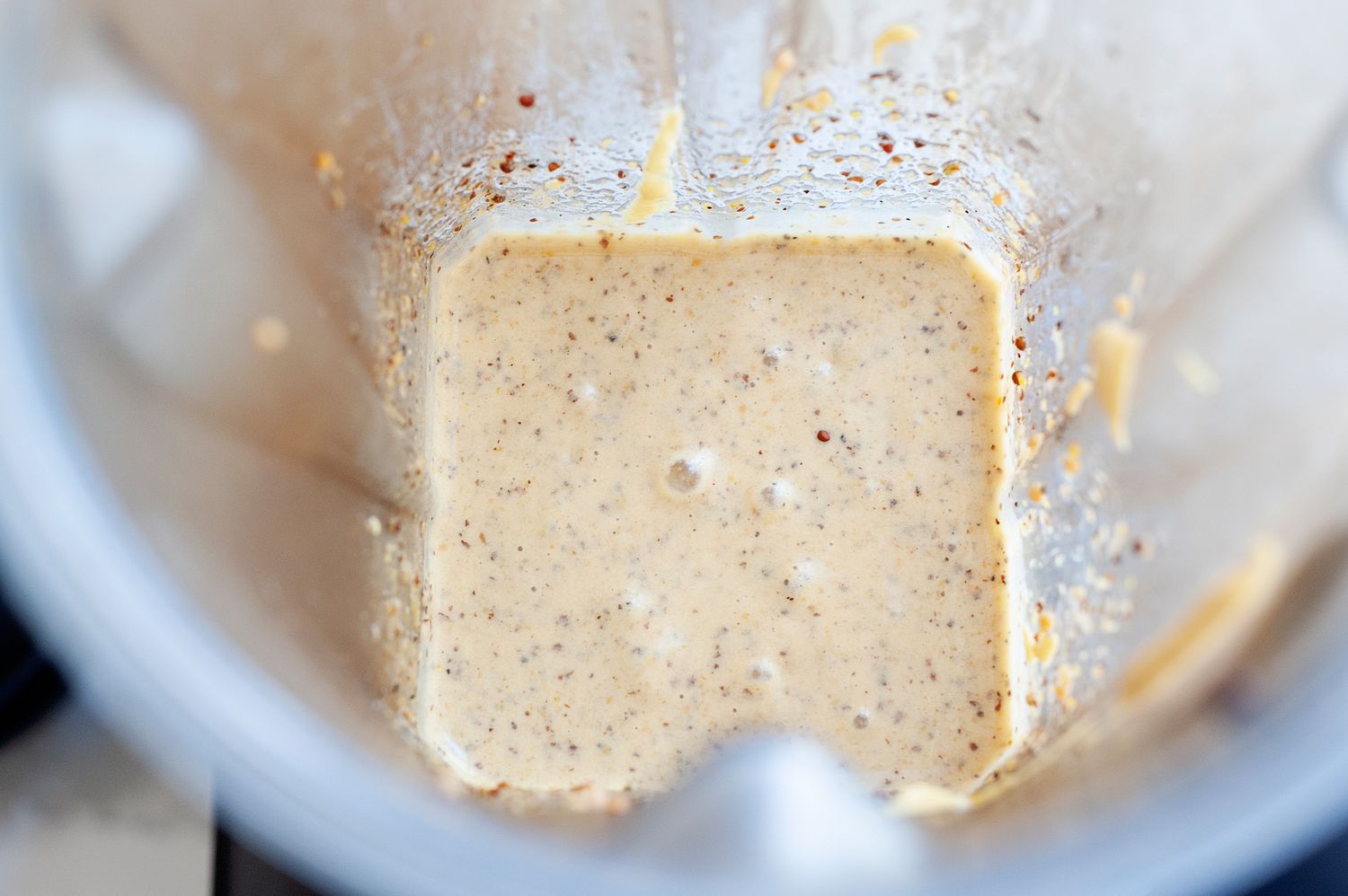 Blender with homemade honey mustard inside.