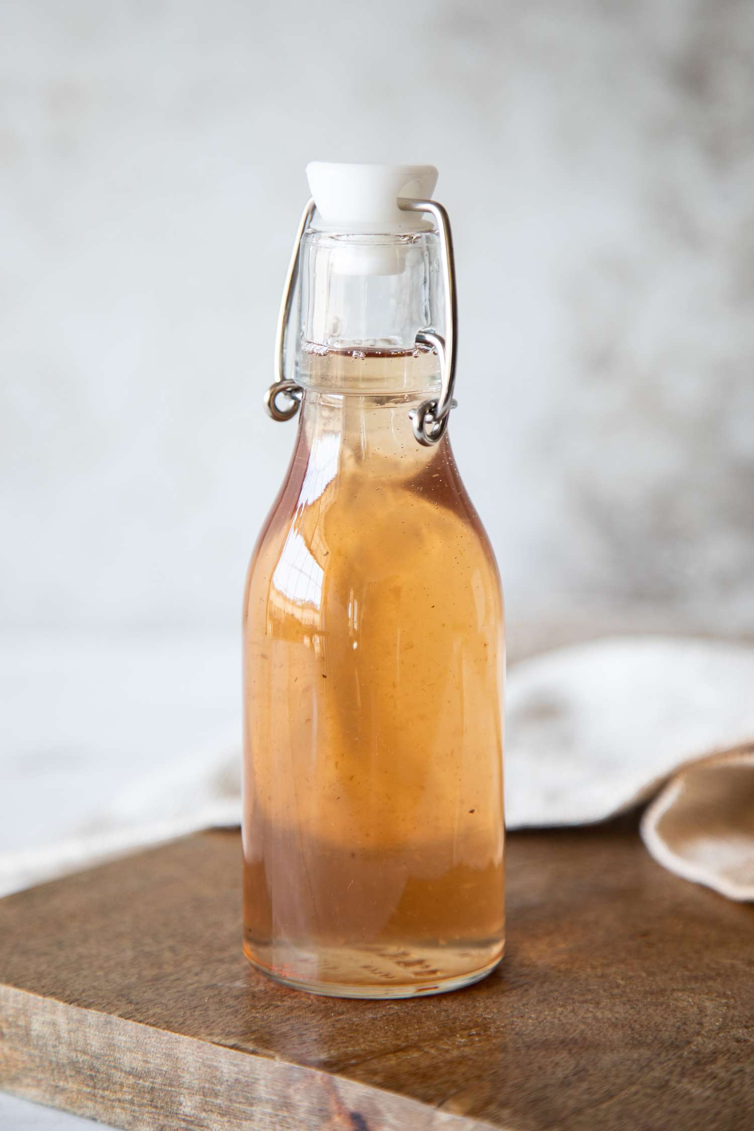 Spiced apple core simple syrup in swing top bottle