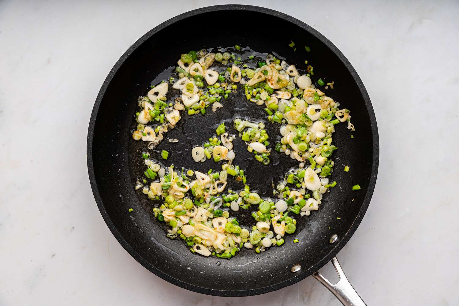 aromatics cooking in the same pan after the chicken is removed for easy chicken primavera recipe