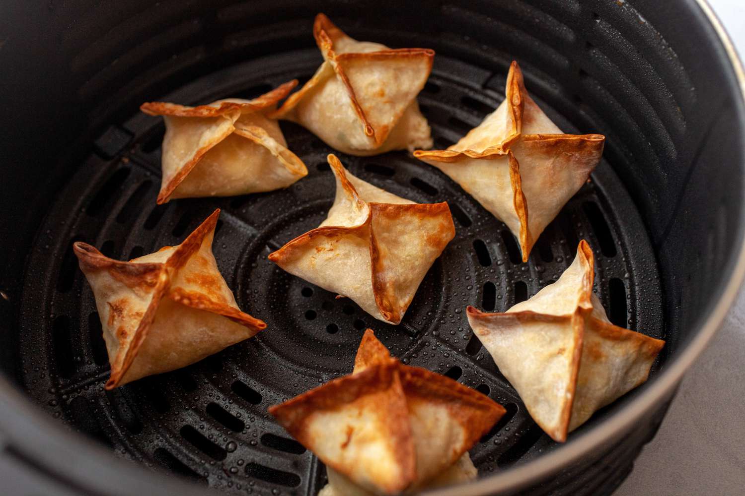 Crispy homemade cream cheese wontons after frying in the air fryer