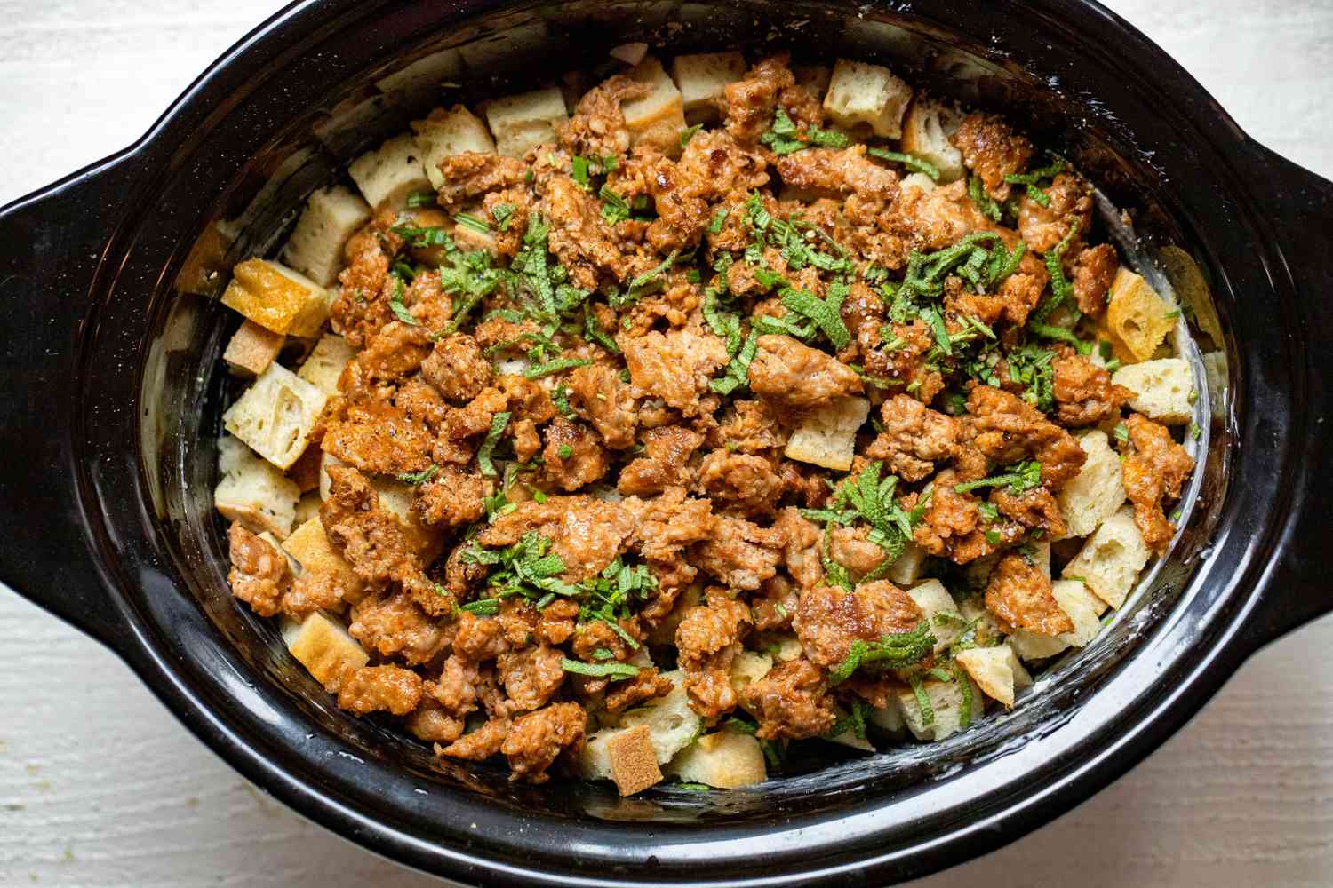 Toasted Bread, Pork Sausage, and Herbs Added to Slow Cooker Stuffing