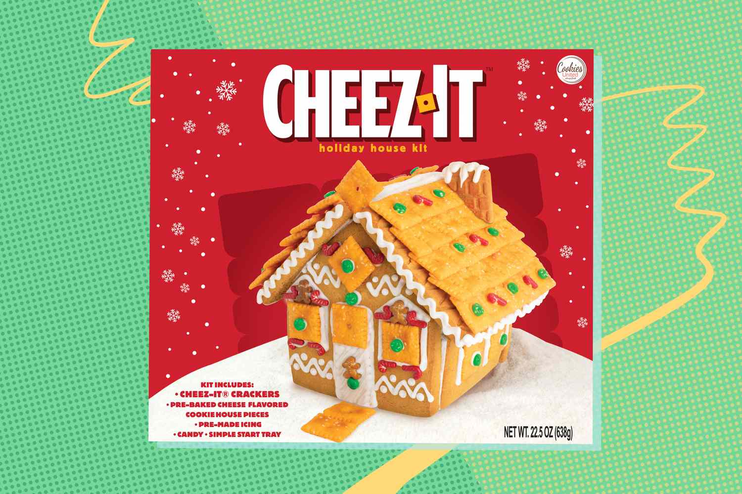 A holiday gingerbreadstyle house made of CheezIt crackers displayed on a product box for a holiday house kit
