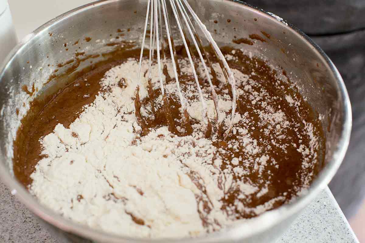 whisking flour into cake batter