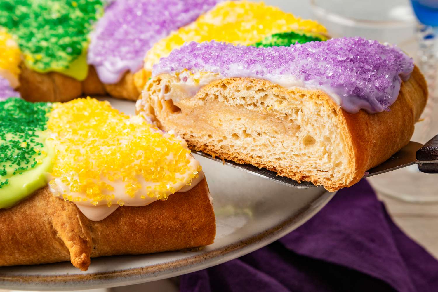Slice of king cake lifted off the cake pan