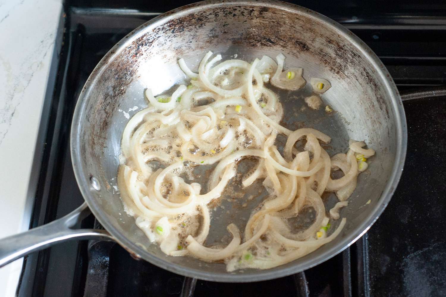 Sautee Onions in Skillet for Zucchini Stirfry Recipe