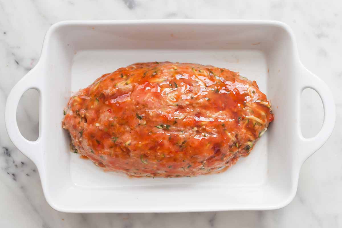 Turkey Meatloaf covered with sweet chili sauce glaze and ready for the oven