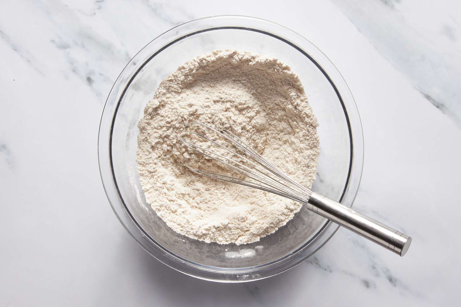 Bowl of dry ingredients whisked together for Dr. Pepper cake recipe