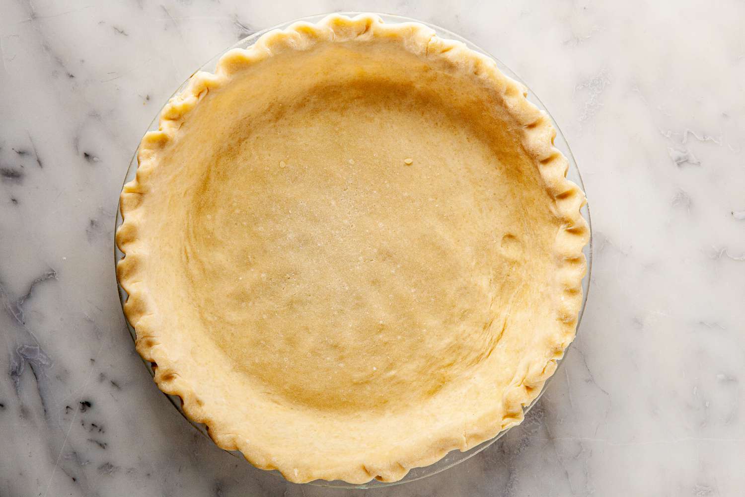 The pie crust for chocolate pecan pie with bourbon.