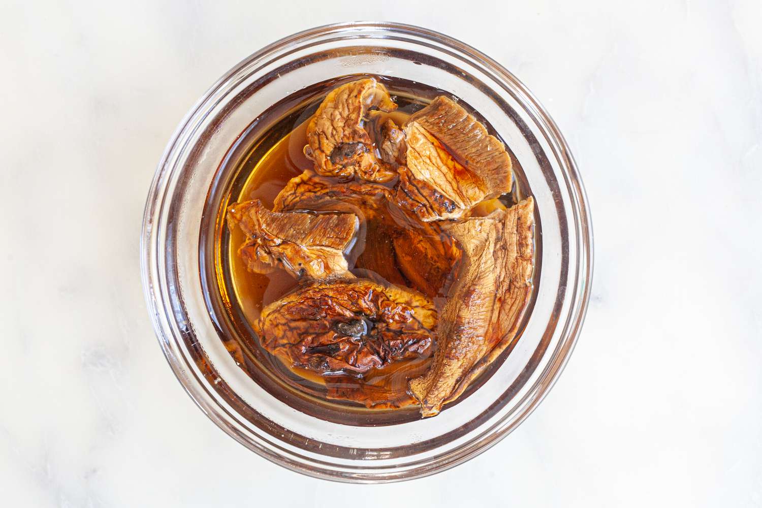 Rehydrating porcini mushrooms to make a turkey breast recipe.