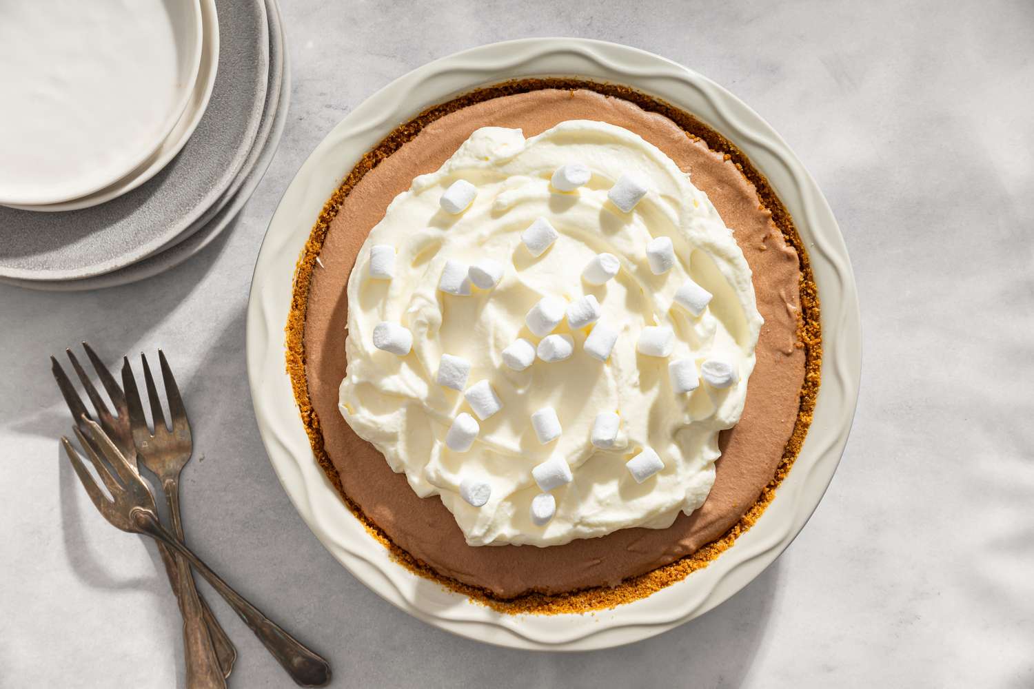 overhead view of Granny’s Party Pie with forks and dessert plates on the side